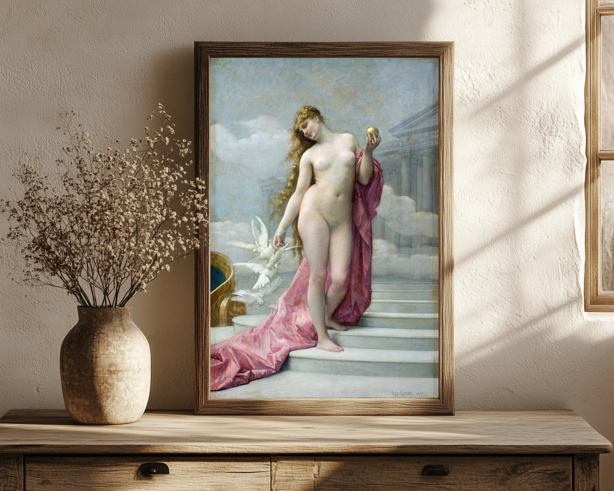 Framed art print of Venus by Alexandre Cabanel, in a dark wood frame leaning on a rustic console beside dried flowers