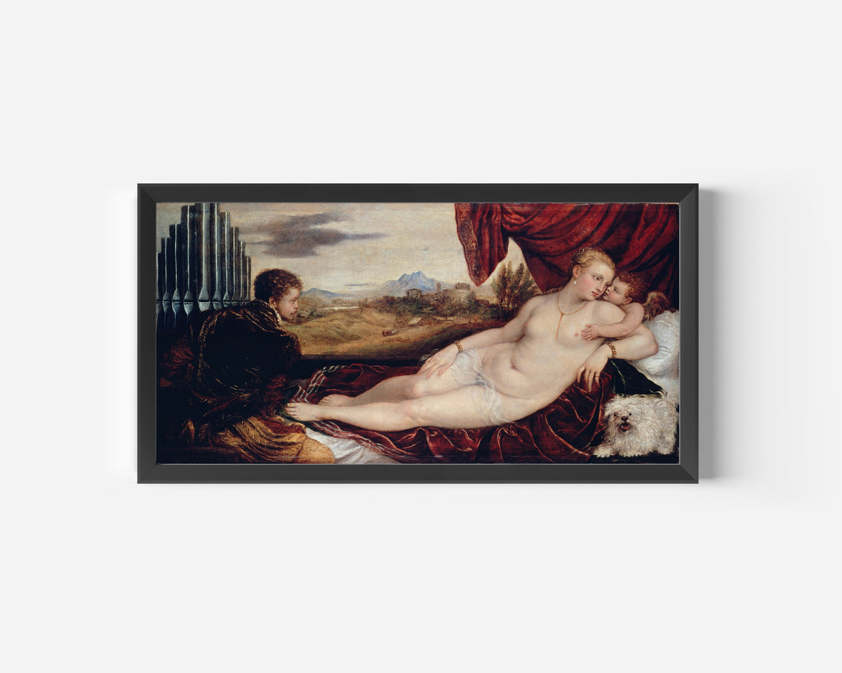 Framed art print of Venus with the Organ Player by Titian, in a wide black frame on a plain white wall