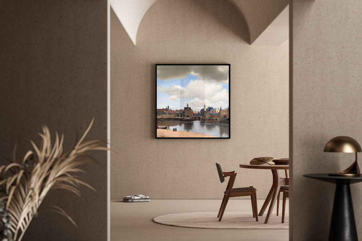 Framed art print of View of Delft by Johannes Vermeer, in a sunlit dining corner