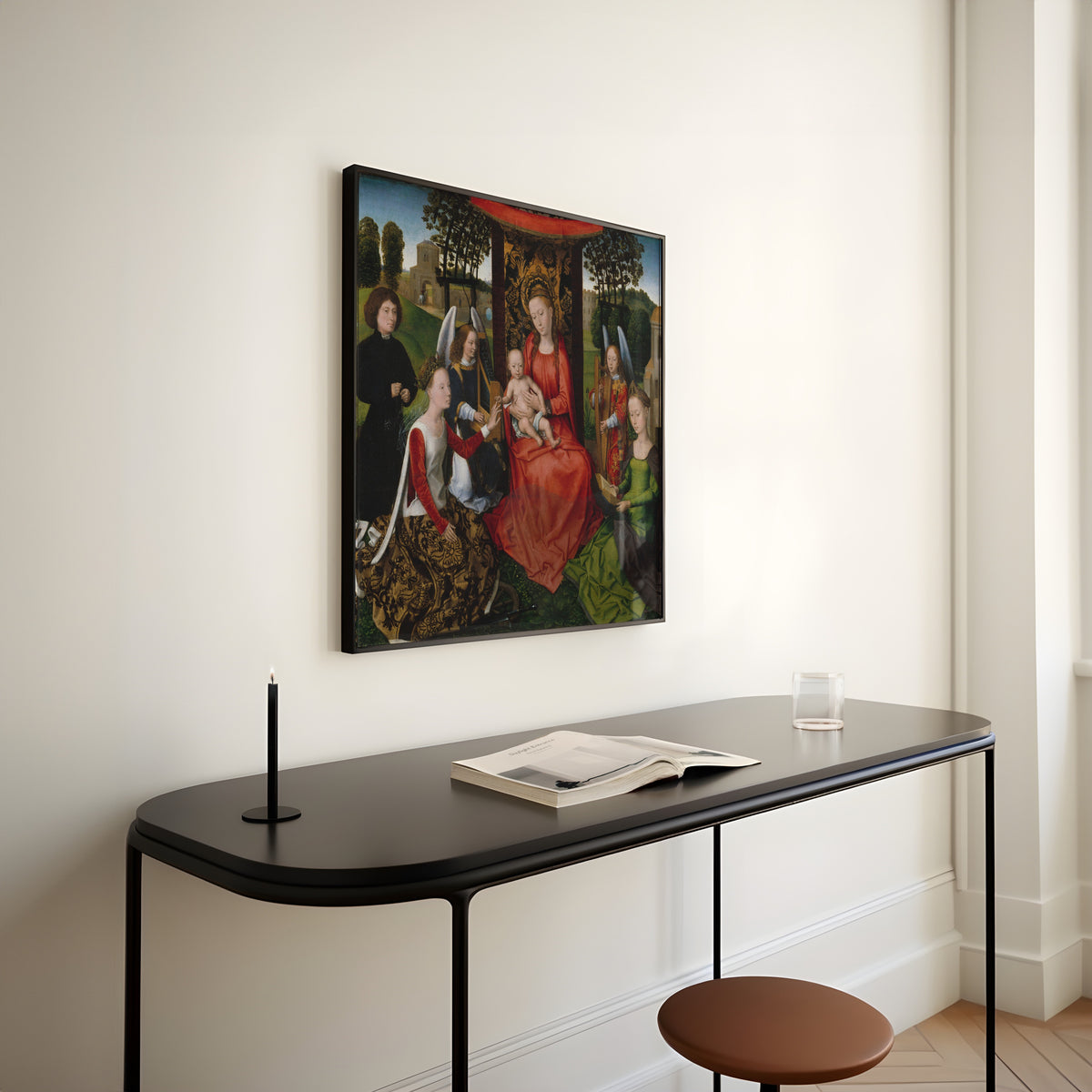 Framed art print of Virgin and Child with Saints Catherine of Alexandria and Barbara by Hans Memling, above a slim black console table
