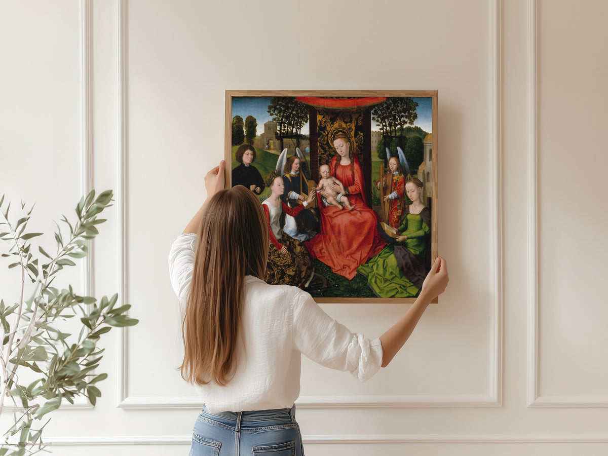 Framed art print of Virgin and Child with Saints Catherine of Alexandria and Barbara by Hans Memling, hung on a panelled wall