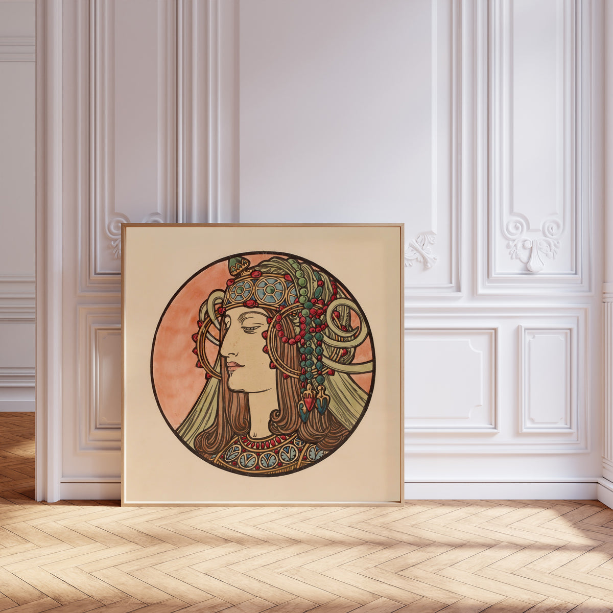 Framed art print of Vitrail pour la façade de la boutique Fouquet (jewelled… by Alphonse Mucha, leaning against pale pink panelling on a herringbone floor