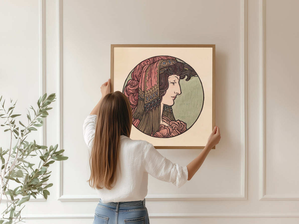 Framed art print of Vitrail pour la façade de la boutique Fouquet (pink headcloth) by Alphonse Mucha, hung on a panelled wall