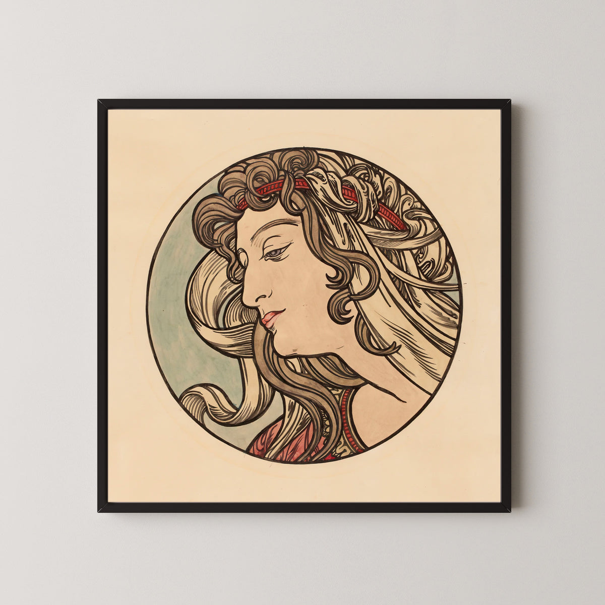 Framed art print of Vitrail pour la façade de la boutique Fouquet (red headband) by Alphonse Mucha, in a black frame on a pale wall