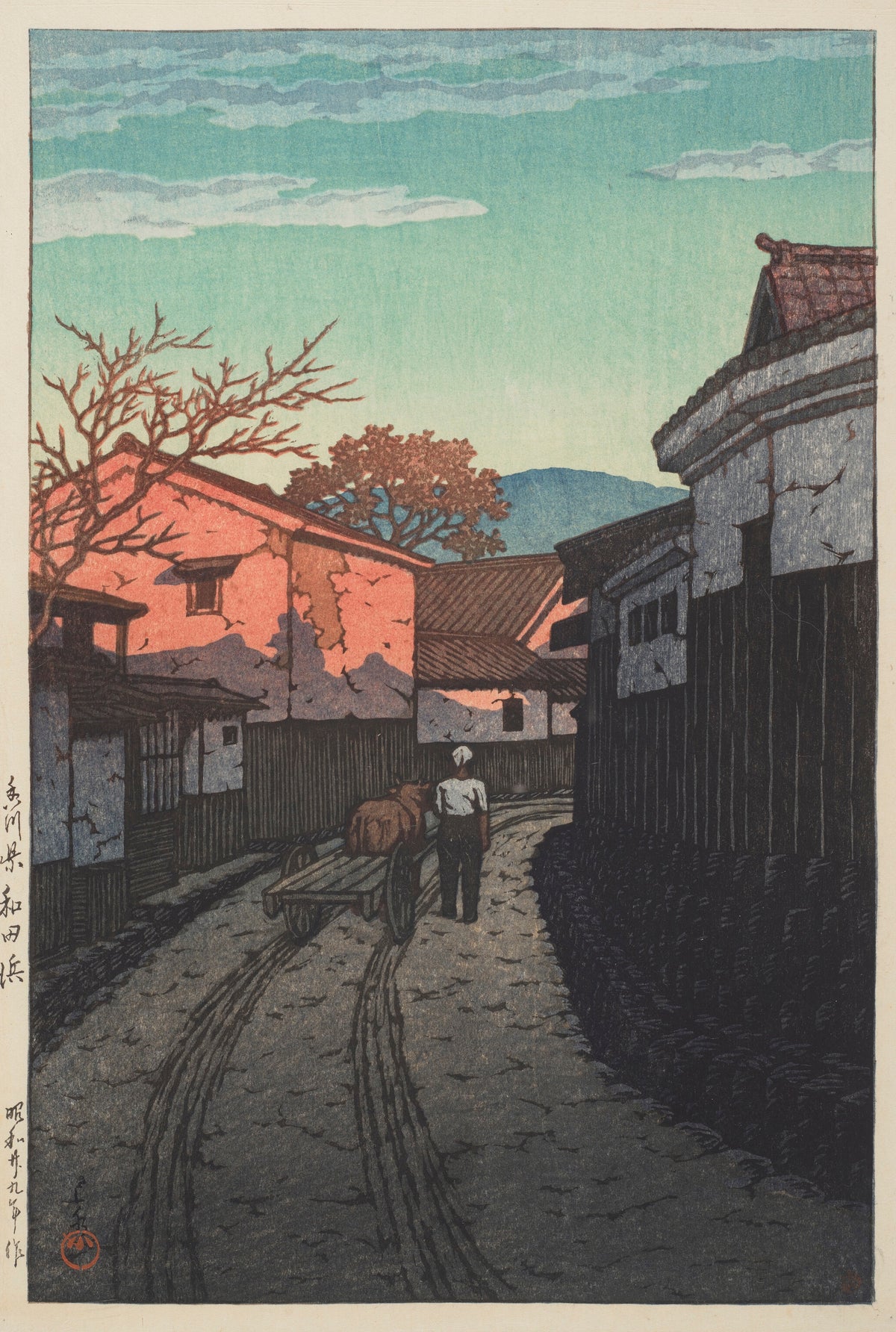 Wadahama in Kagawa Prefecture by Kawase Hasui — A man walks beside a handcart down a lane of glowing pink walls