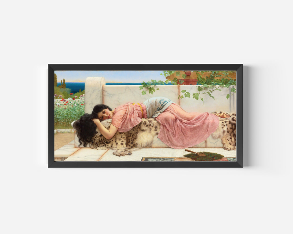 Framed art print of When the Heart is Young by John William Godward, in a wide black frame on a plain white wall