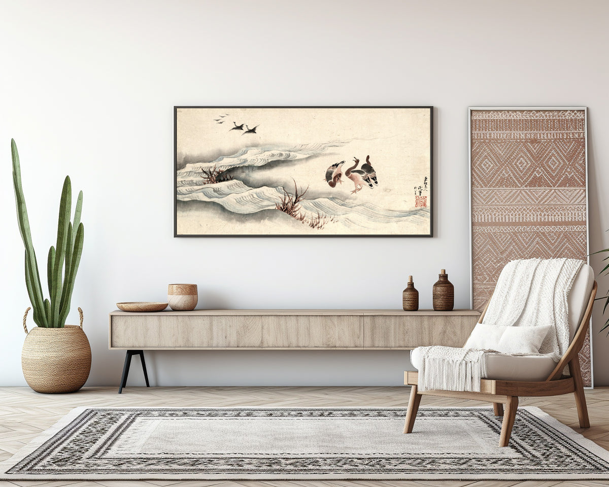 Framed art print of Wild Geese and Water by Katsushika Hokusai, above a sideboard in a living room
