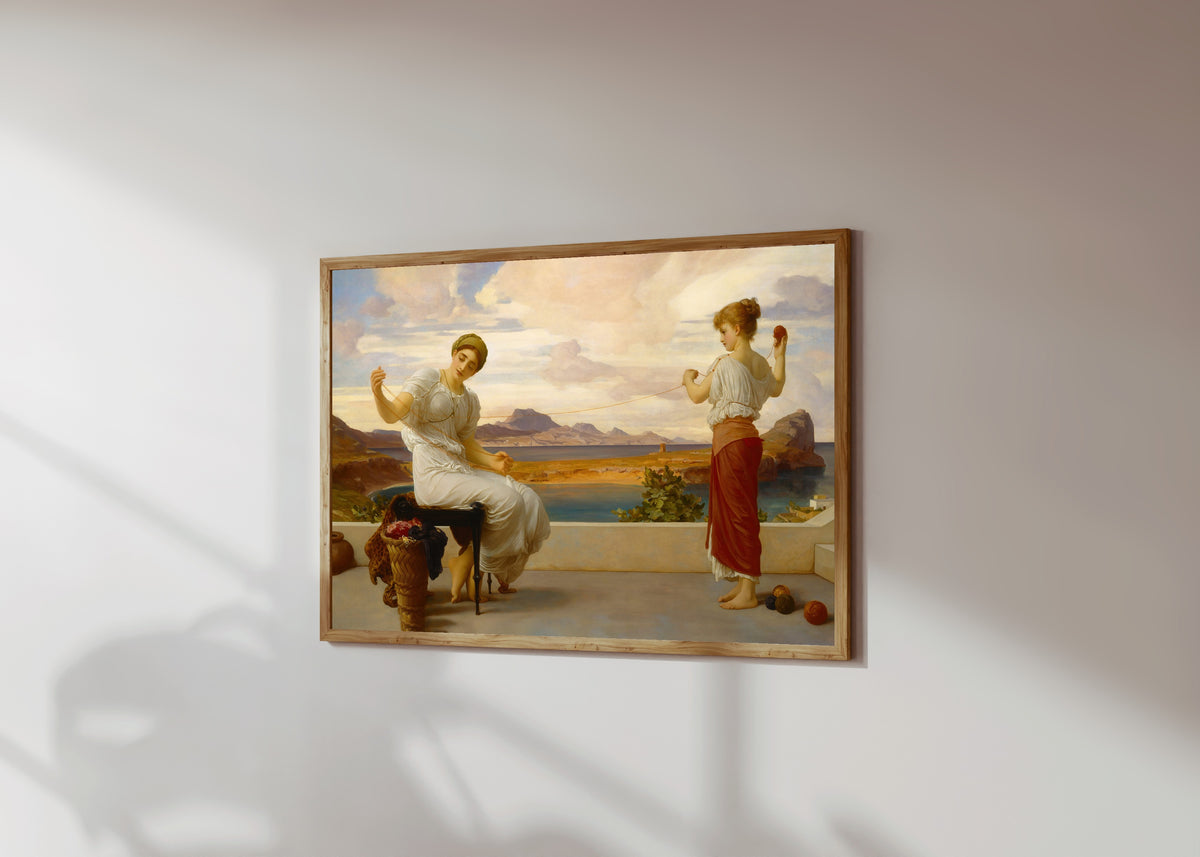 Framed art print of Winding the Skein by Frederic Leighton, in a light wood frame on a sunlit white wall, seen at a slight angle