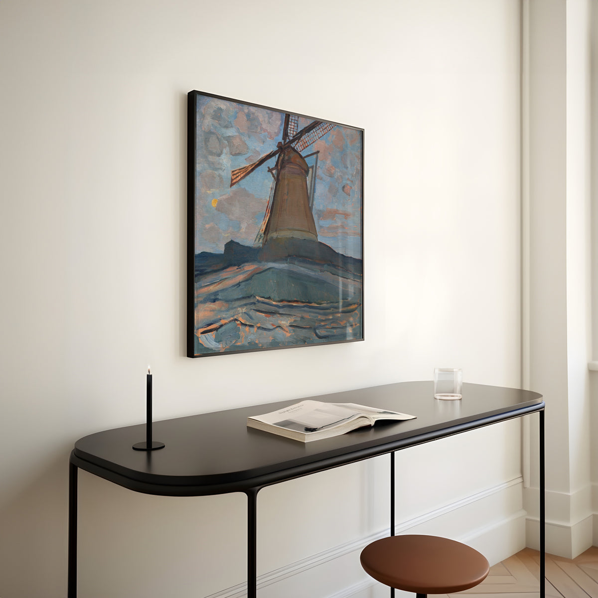 Framed art print of Windmill by Piet Mondrian, above a slim black console table