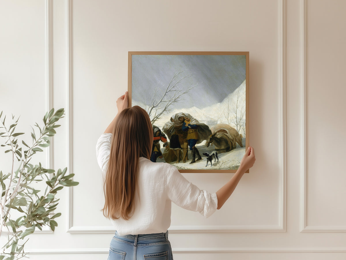Framed art print of Winter Scene by Francisco de Goya, hung on a panelled wall