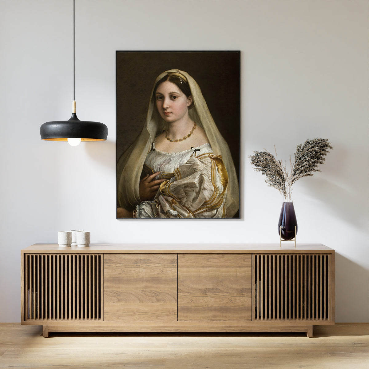 Framed art print of Woman with a Veil by Raphael, above a slatted wood sideboard