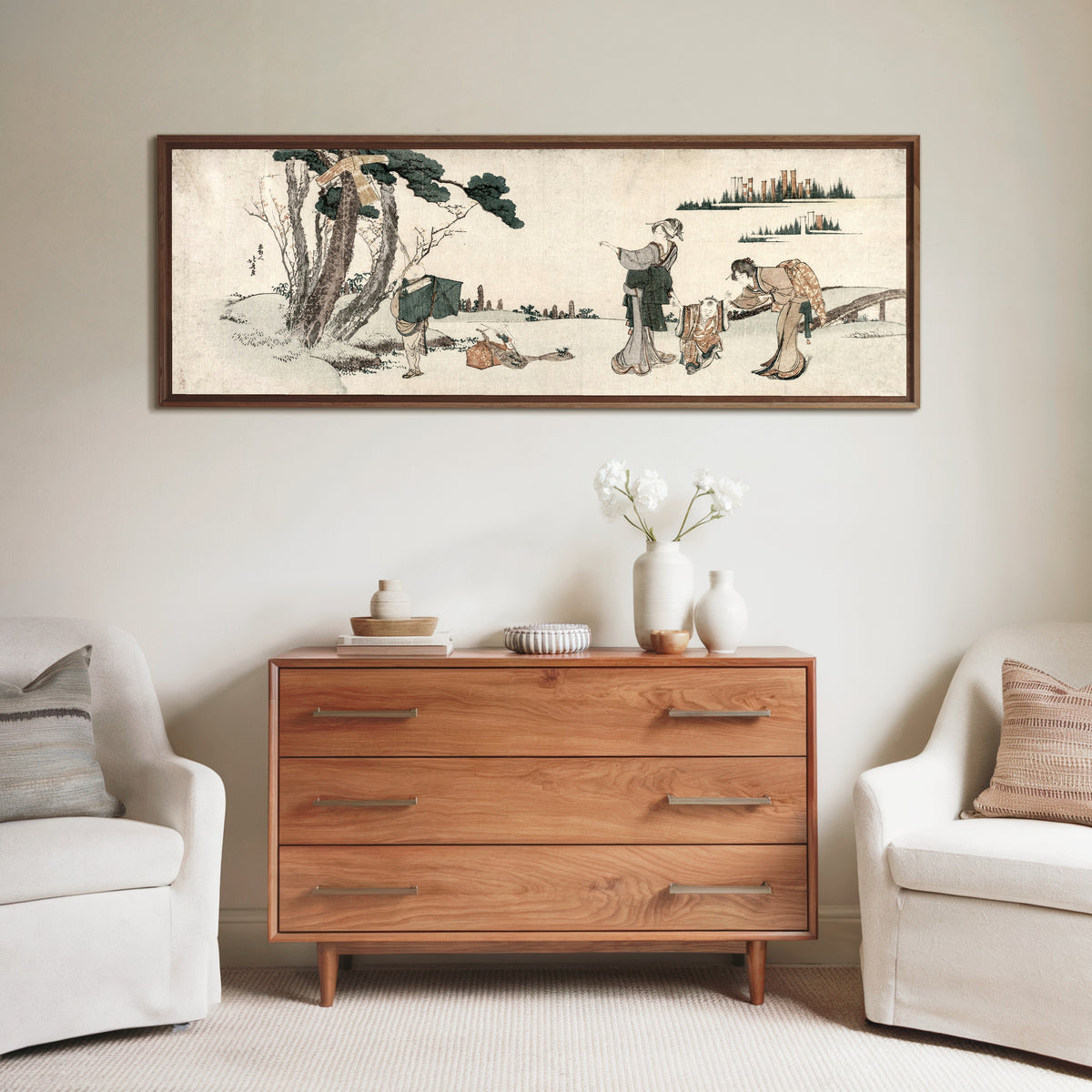 Framed art print of Women Distracting a Child whose Kite is caught in a Tree by Katsushika Hokusai, above a wooden chest of drawers