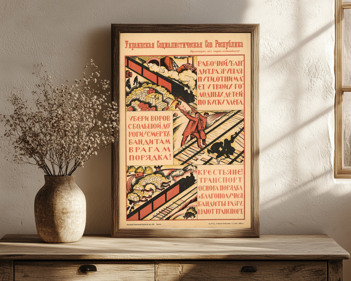 Framed art print of Worker! The bandit, wrecking the rails, takes a piece of bread from…, in a dark wood frame leaning on a rustic console beside dried flowers