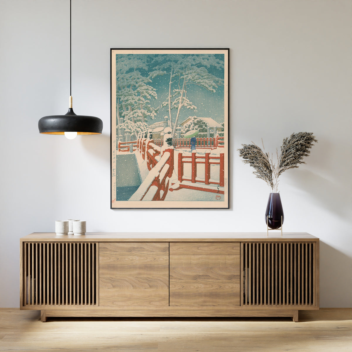 Framed art print of Yakumo Bridge at Nagata Shrine, Kobe by Kawase Hasui, above a slatted wood sideboard