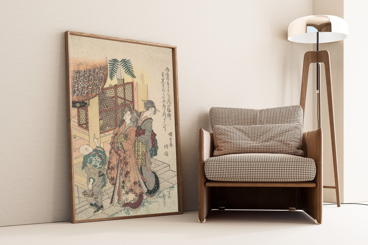 Framed art print of Young Ladies Paying Homage to a Shrine by Katsushika Hokusai, leaning against a wall beside an armchair and a floor lamp