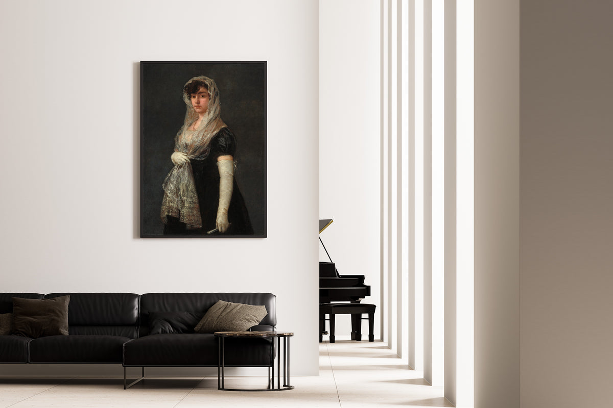 Framed art print of Young Lady Wearing a Mantilla and Basquina by Francisco de Goya, on the wall of a minimal living room