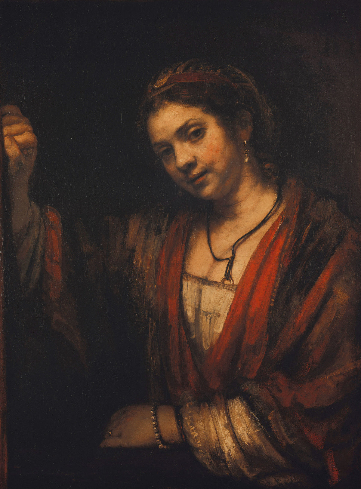 Young Woman at the Open Top Door by Rembrandt van Rijn — A young woman in a red wrap leans out over a half-open door