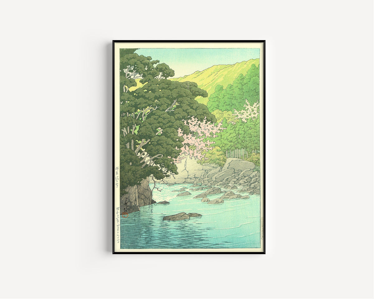 Framed art print of Yugashima, Izu by Kawase Hasui, in a slim black frame on a plain white wall
