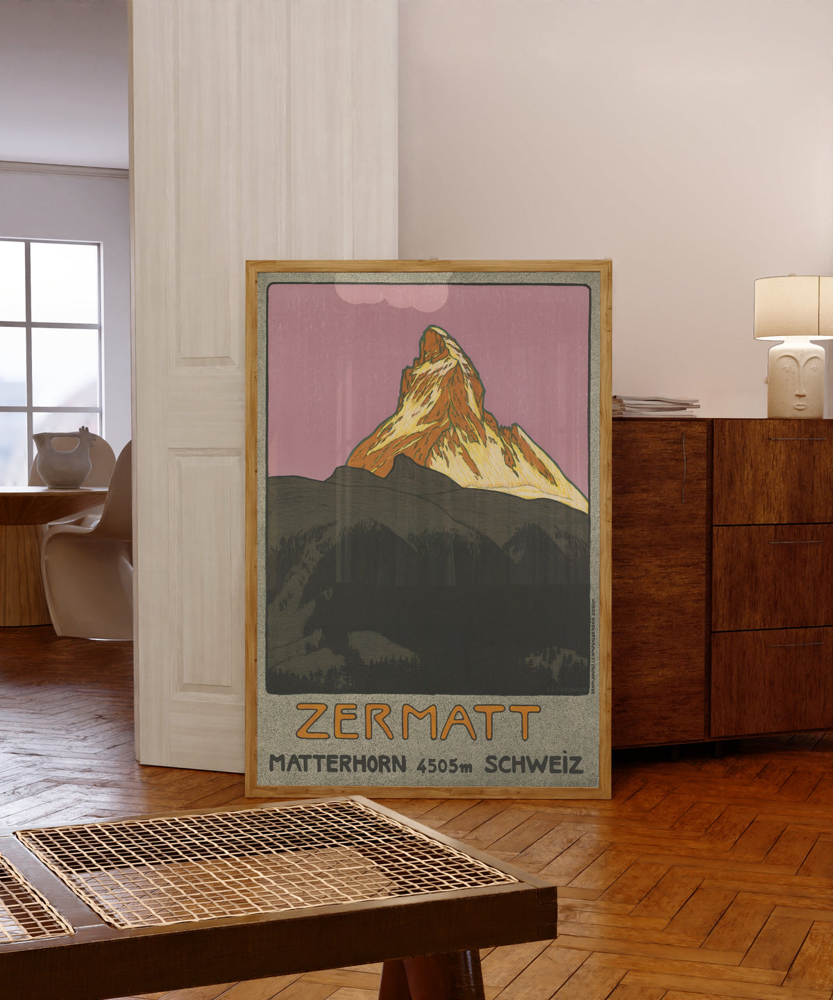 Framed art print of Zermatt: Matterhorn 4505 m, Schweiz by Emil Cardinaux, in a light wood frame leaning in a warm room with a parquet floor