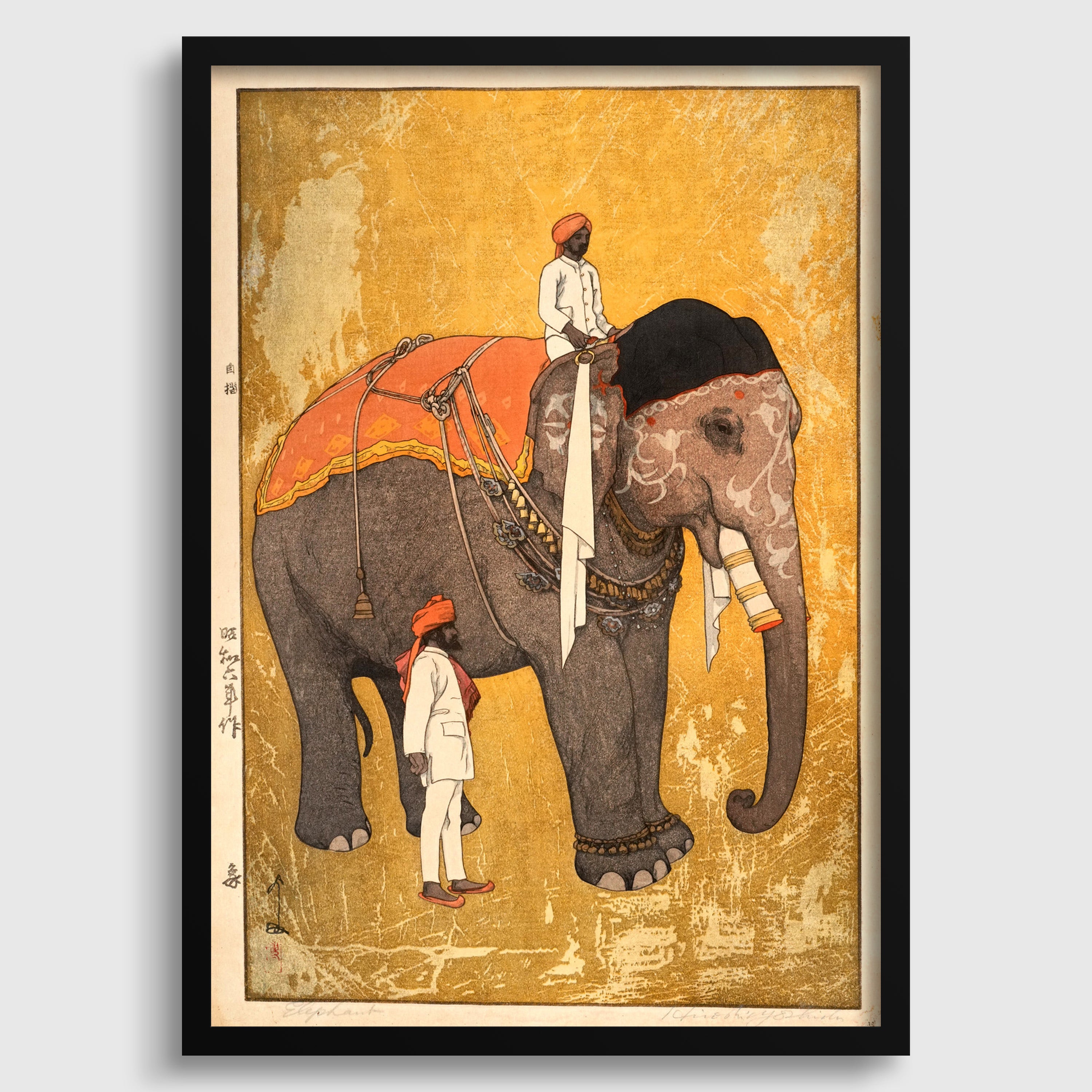 a man riding an elephant, with another person standing nearby.