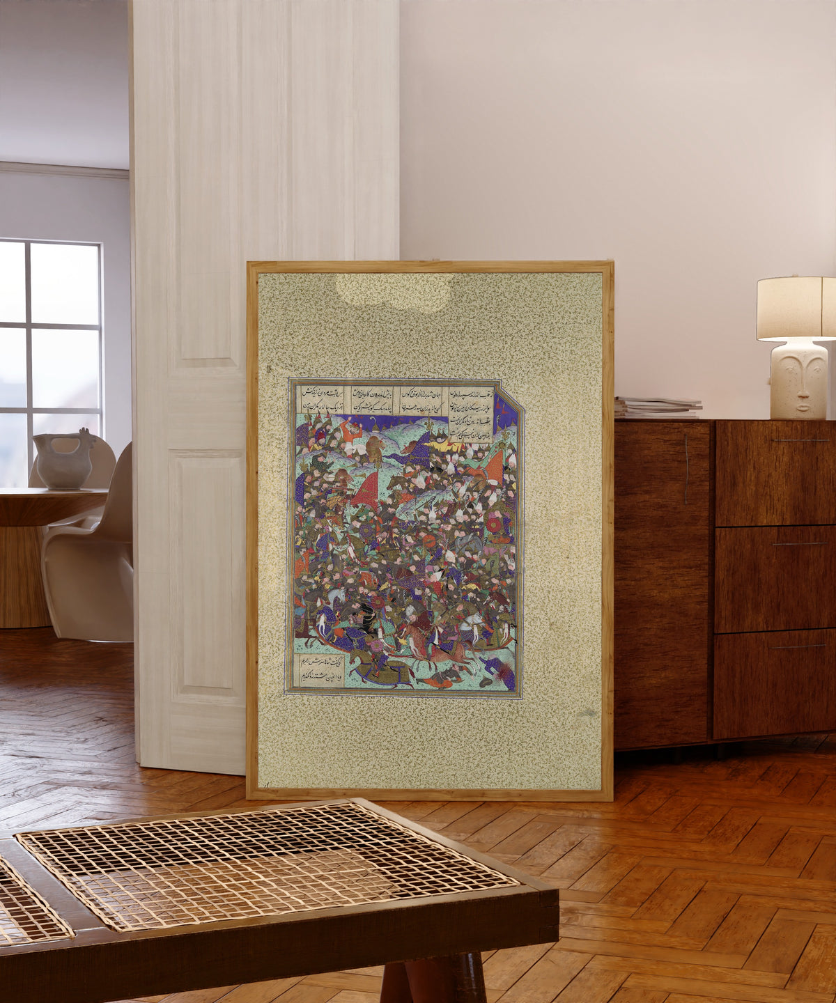 Framed art print of Shahnama of Shah Tahmasp: Kai Khusrau… by Abd al-Vahhab (attributed), in a light wood frame leaning in a warm room with a parquet floor