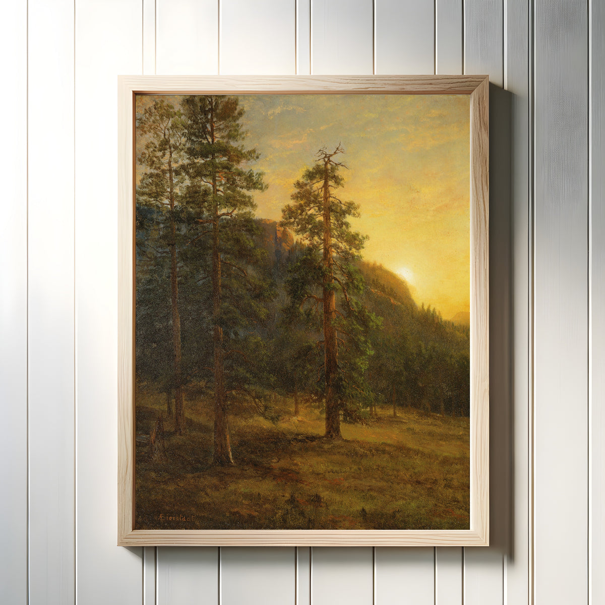 Framed art print of California Redwoods by Albert Bierstadt, in a light wood frame on a white panelled wall