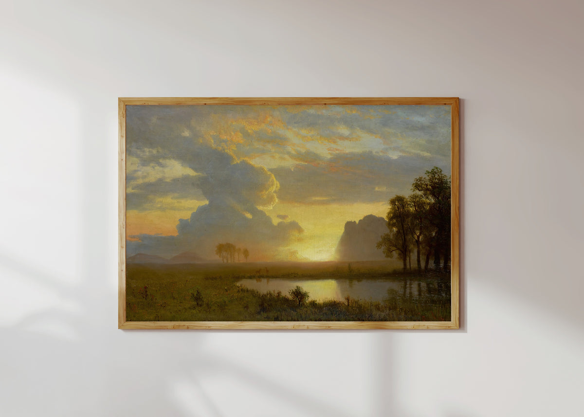 Framed art print of Estes Park, Colorado by Albert Bierstadt, in a light wood frame on a sunlit white wall