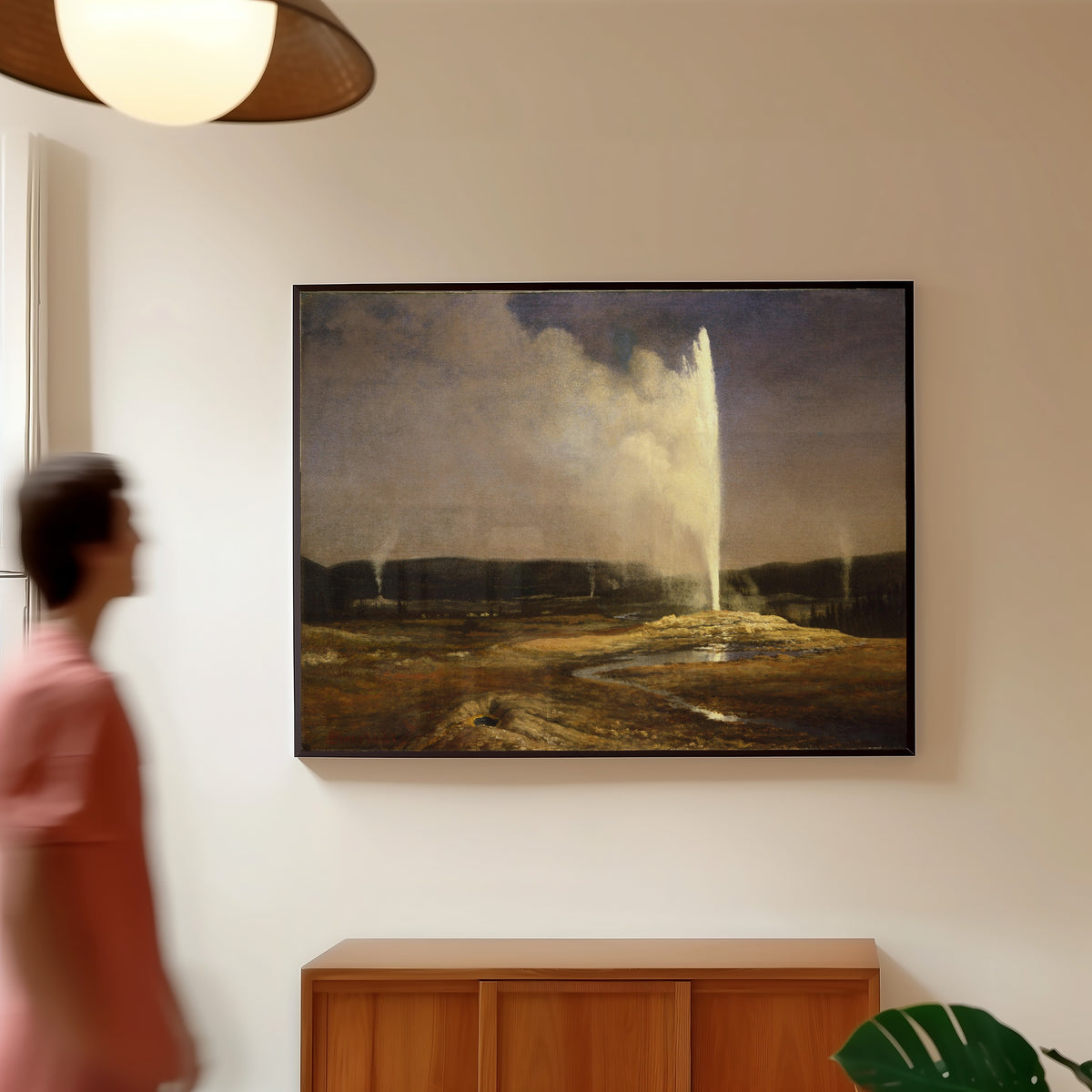 Framed art print of Geysers by Albert Bierstadt, in a slim black frame on a warm wall in a sunlit room