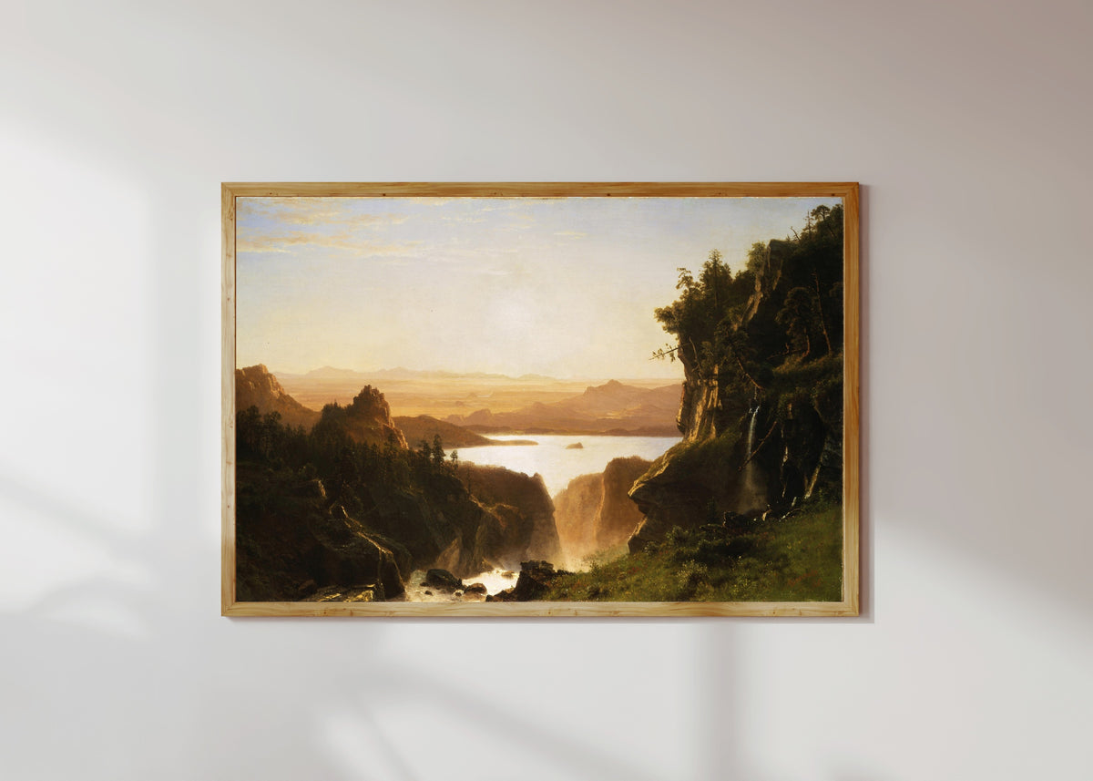 Framed art print of Island Lake by Albert Bierstadt, in a light wood frame on a sunlit white wall