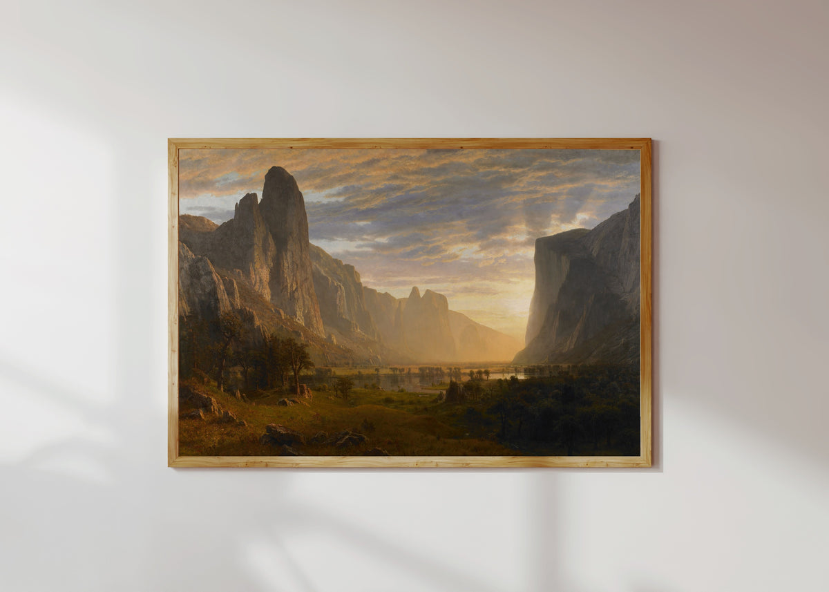 Framed art print of Looking Down Yosemite Valley by Albert Bierstadt, in a light wood frame on a sunlit white wall