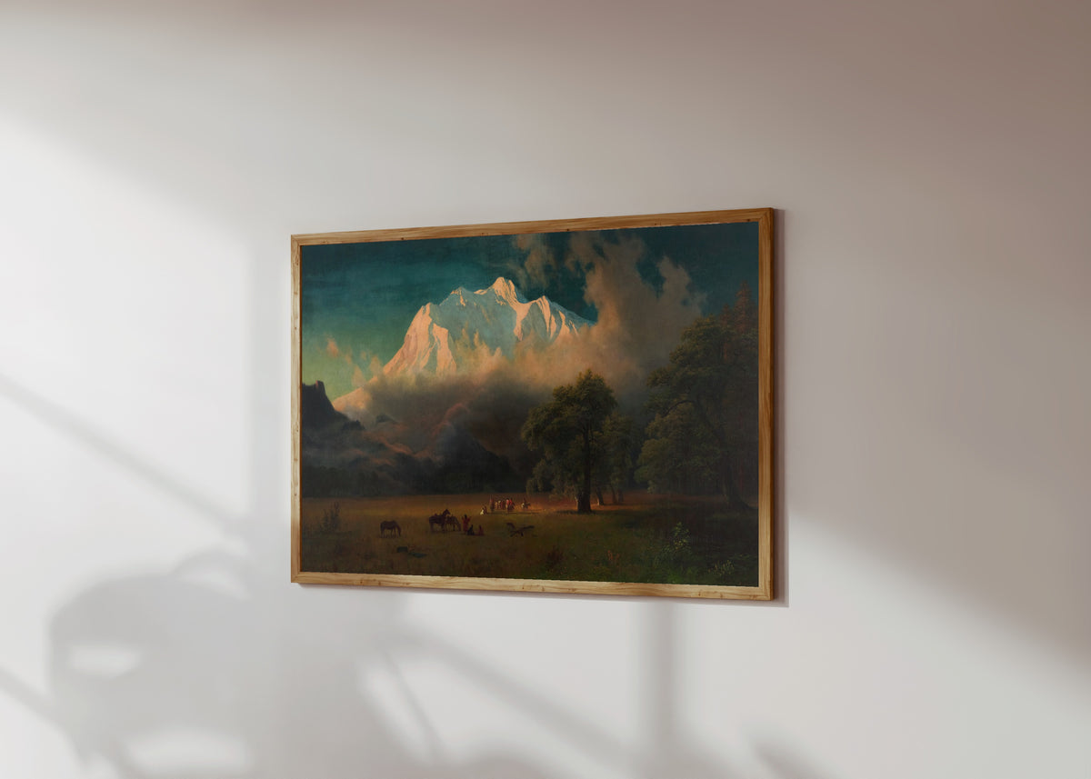 Framed art print of Mount Adams, Washington by Albert Bierstadt, in a light wood frame on a sunlit white wall, seen at a slight angle