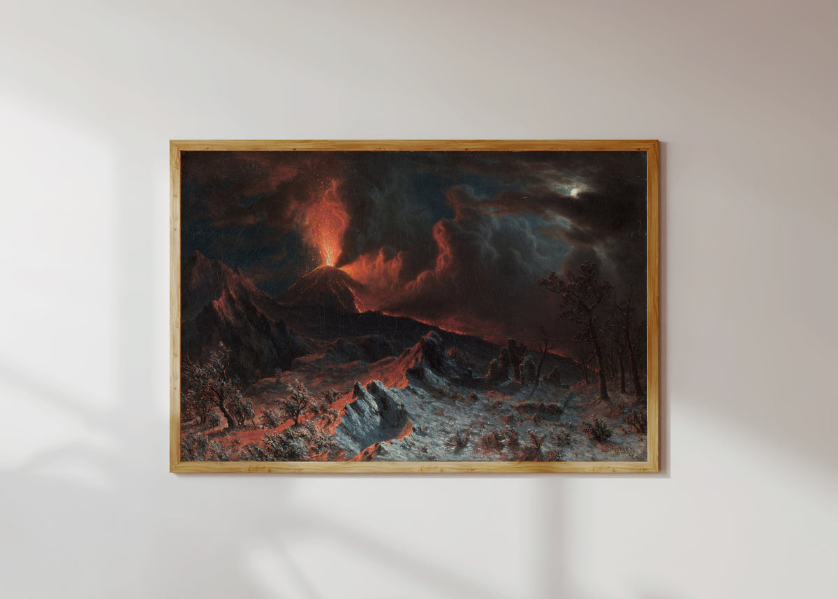 Framed art print of Mount Vesuvius at Midnight by Albert Bierstadt, in a light wood frame on a sunlit white wall