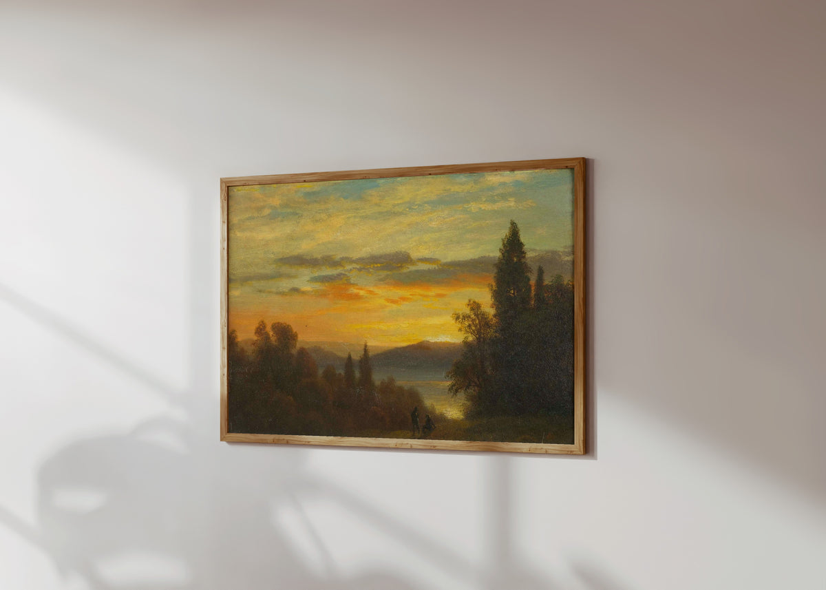 Framed art print of On the Hudson River Near Irvington by Albert Bierstadt, in a light wood frame on a sunlit white wall, seen at a slight angle