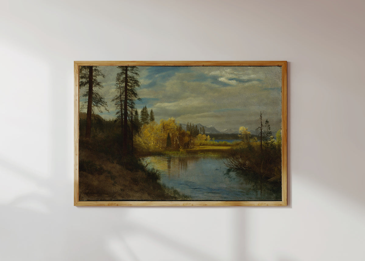 Framed art print of Outlet at Lake Tahoe by Albert Bierstadt, in a light wood frame on a sunlit white wall