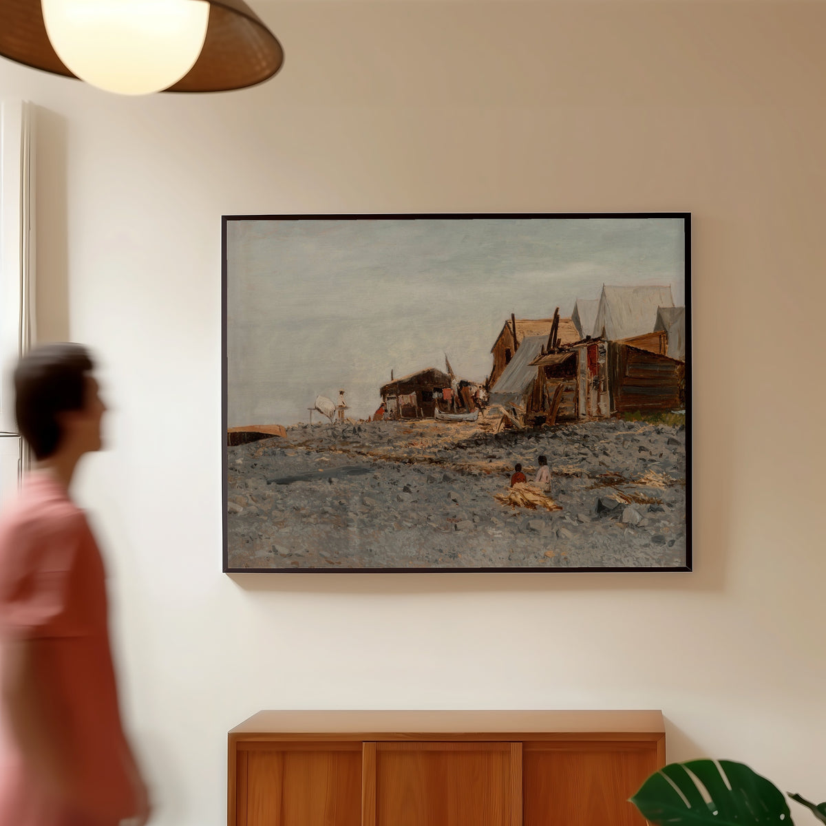 Framed art print of Salmon Fishery Village by Albert Bierstadt, in a slim black frame on a warm wall in a sunlit room