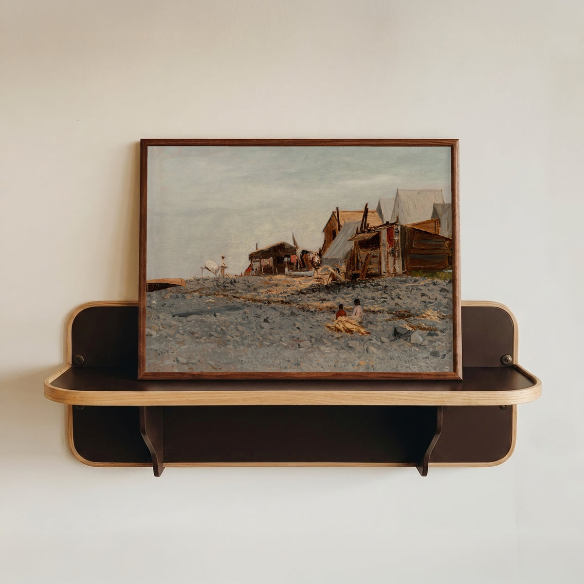 Framed art print of Salmon Fishery Village by Albert Bierstadt, in a dark wood frame resting on a wall shelf