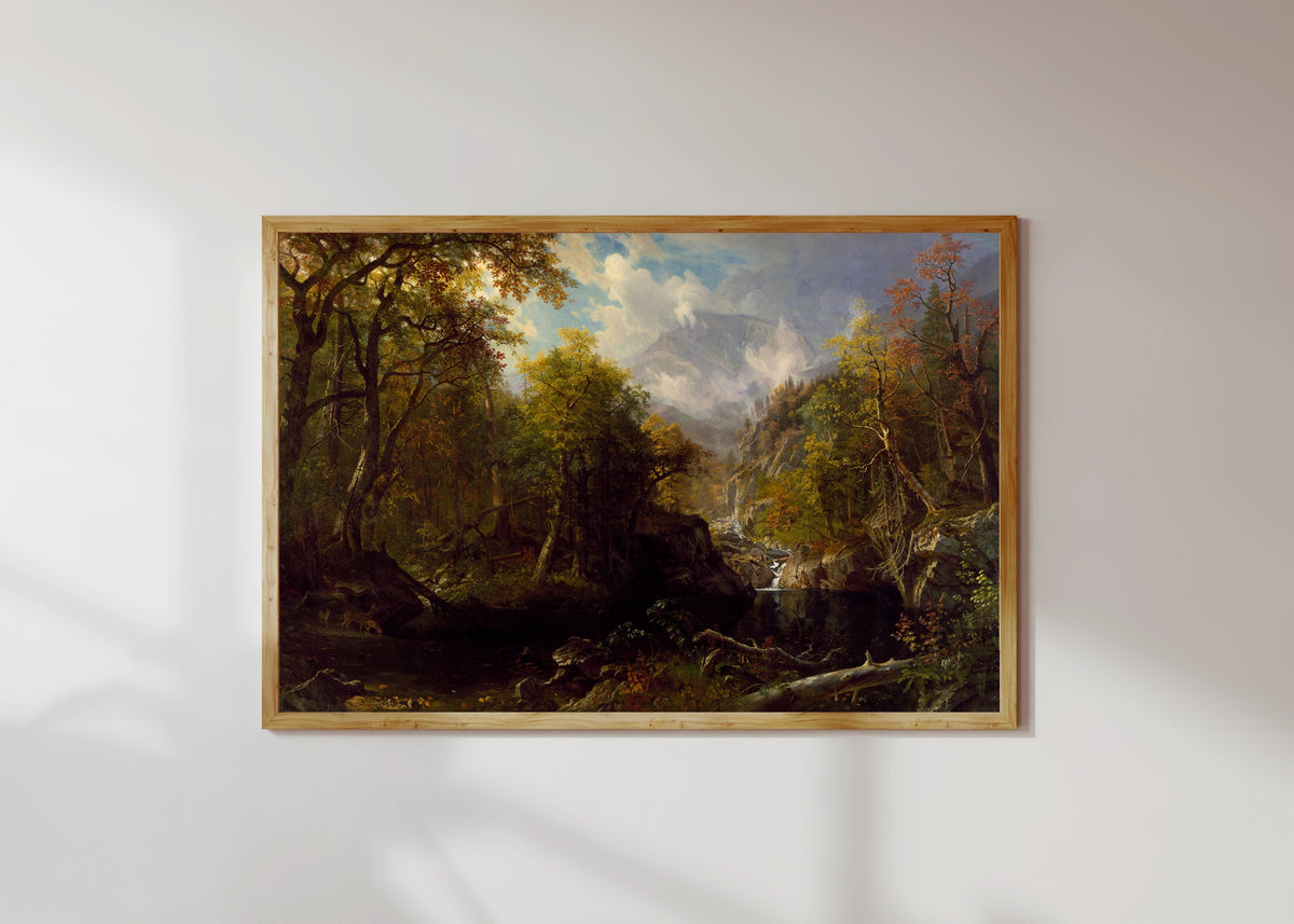 Framed art print of The Emerald Pool by Albert Bierstadt, in a light wood frame on a sunlit white wall