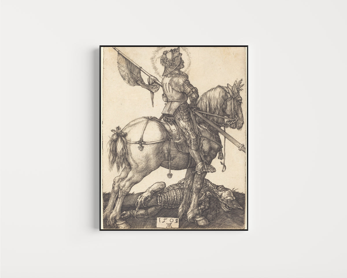 Framed art print of Saint George on Horseback by Albrecht Dürer, in a slim black frame on a plain white wall