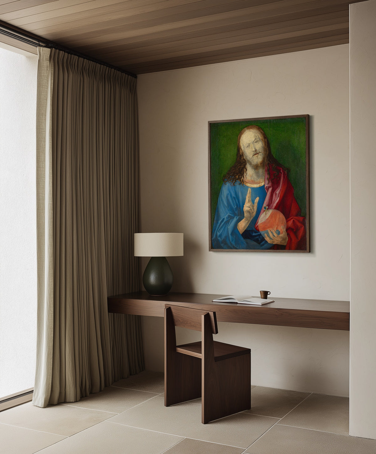 Framed art print of Salvator Mundi by Albrecht Dürer, in a dark wood frame on a plaster wall above a walnut desk