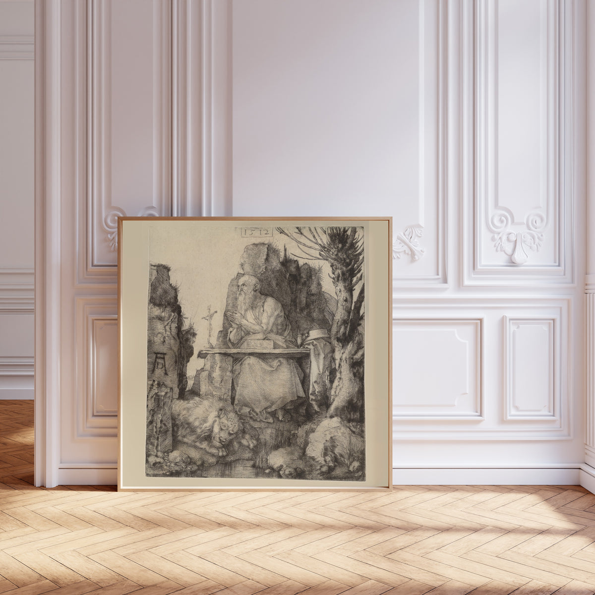 Framed art print of St Jerome in the Wilderness by Albrecht Dürer, leaning against pale pink panelling on a herringbone floor