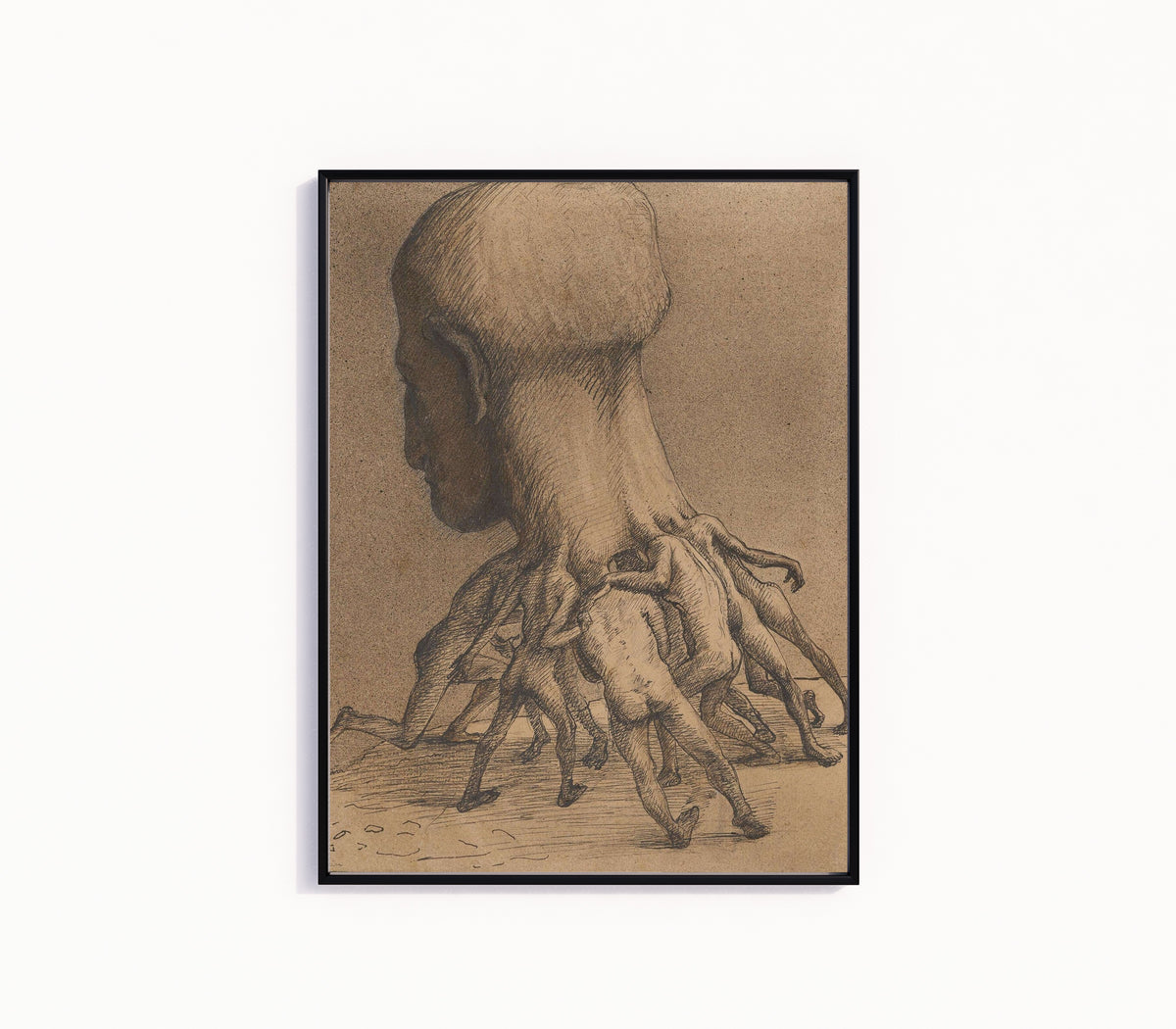Framed art print of The Great Head by Alfred Kubin, in a slim black frame on a plain white wall