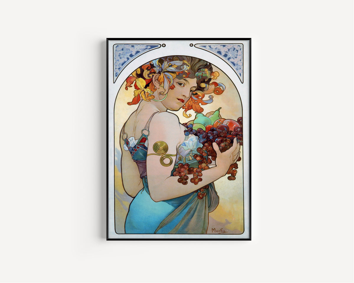 Framed art print of Fruit by Alphonse Mucha, in a slim black frame on a plain white wall