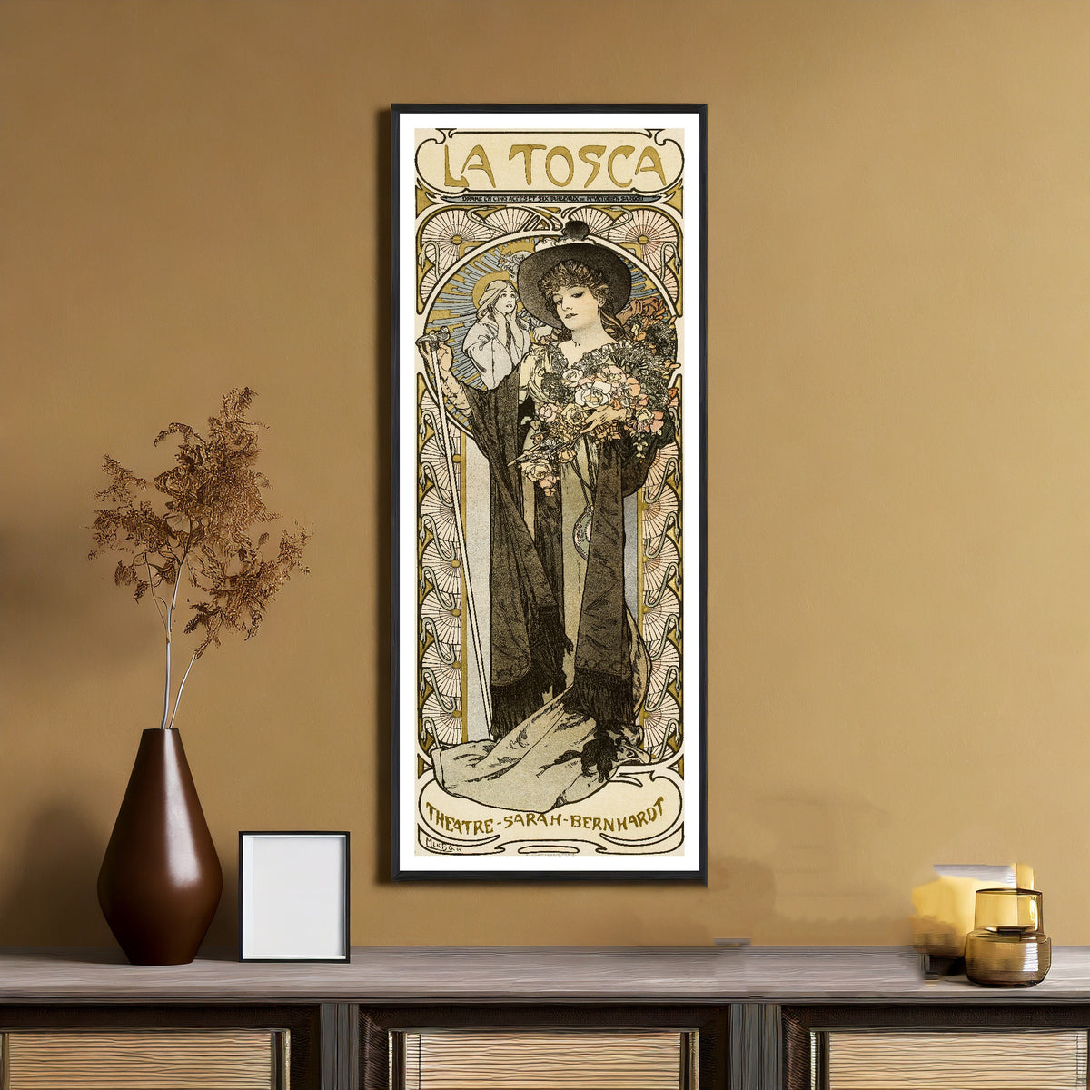 La Tosca by Alphonse Mucha — framed on an ochre wall above a console table