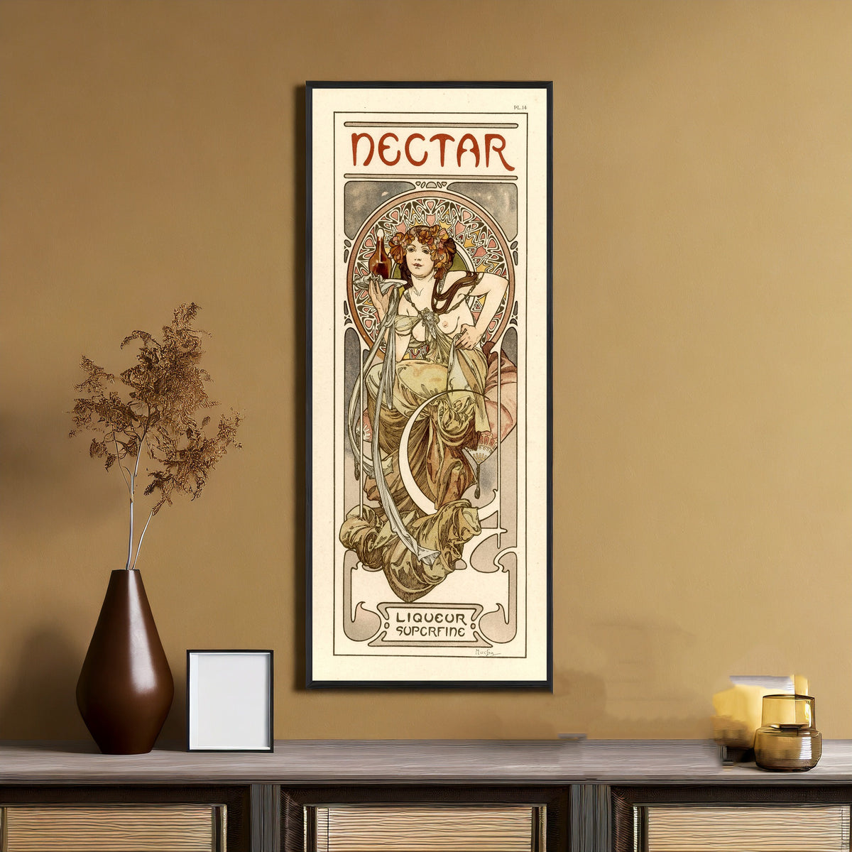 Framed art print of Nectar by Alphonse Mucha, on an ochre wall above a console table