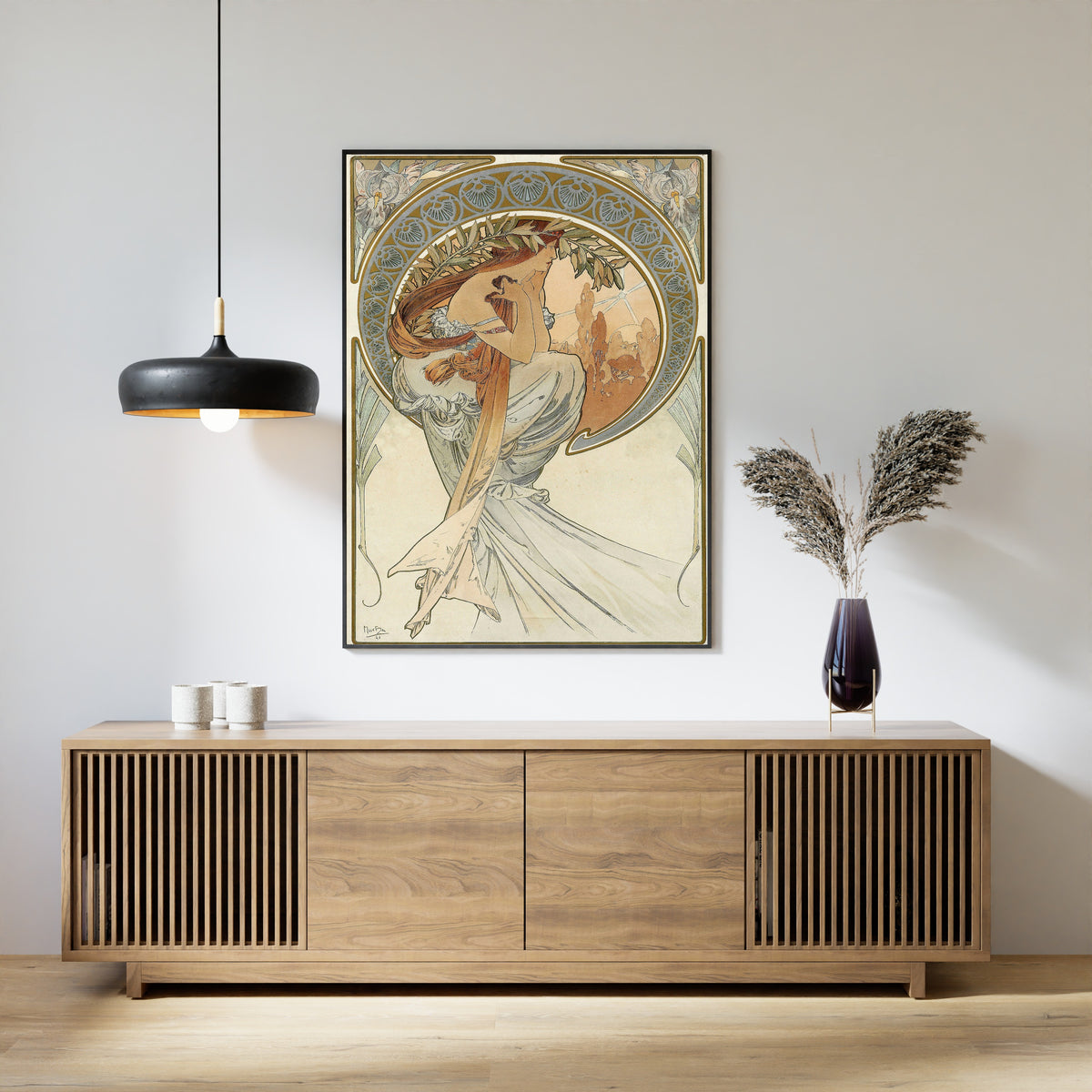 Framed art print of The Arts: Poetry by Alphonse Mucha, above a slatted wood sideboard