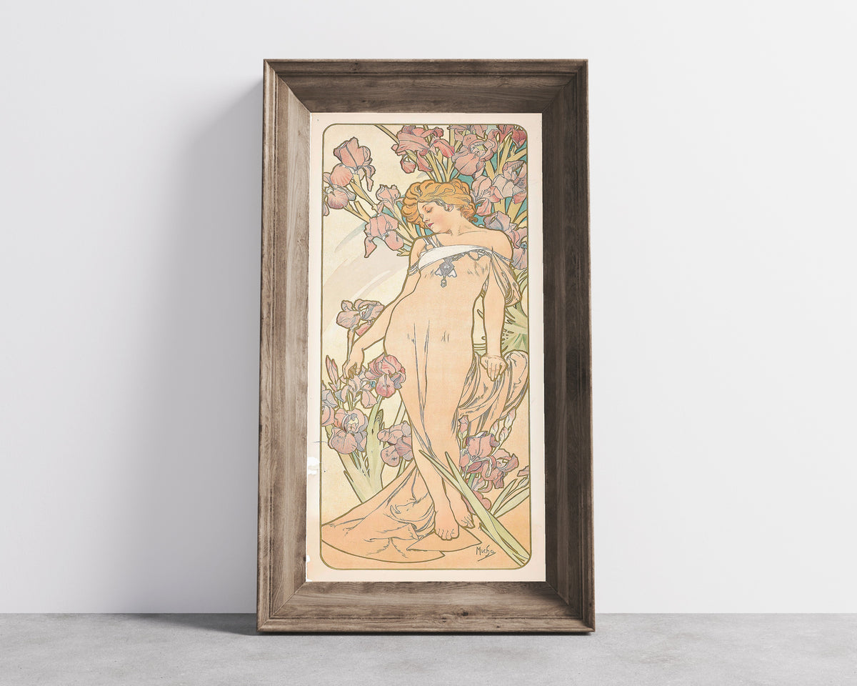The Iris by Alphonse Mucha — in a wide wooden frame leaning against a concrete wall