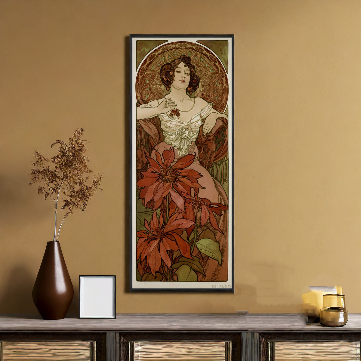 Framed art print of The Ruby by Alphonse Mucha, on an ochre wall above a console table