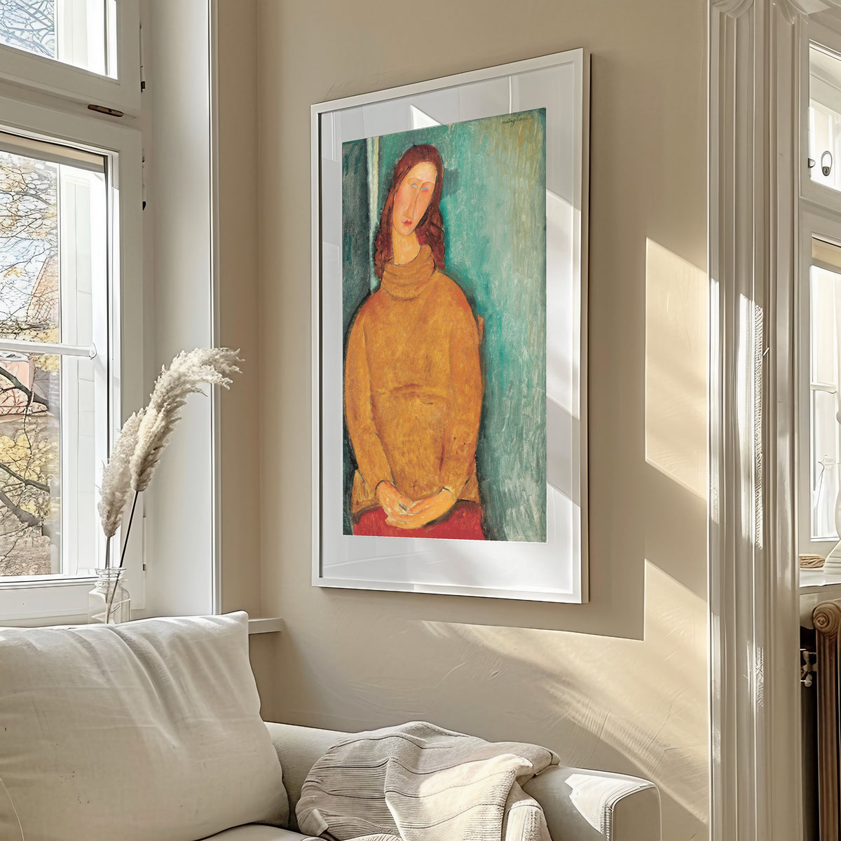 Jeanne Hébuterne by Amedeo Modigliani — framed in a sunlit living room above a sofa
