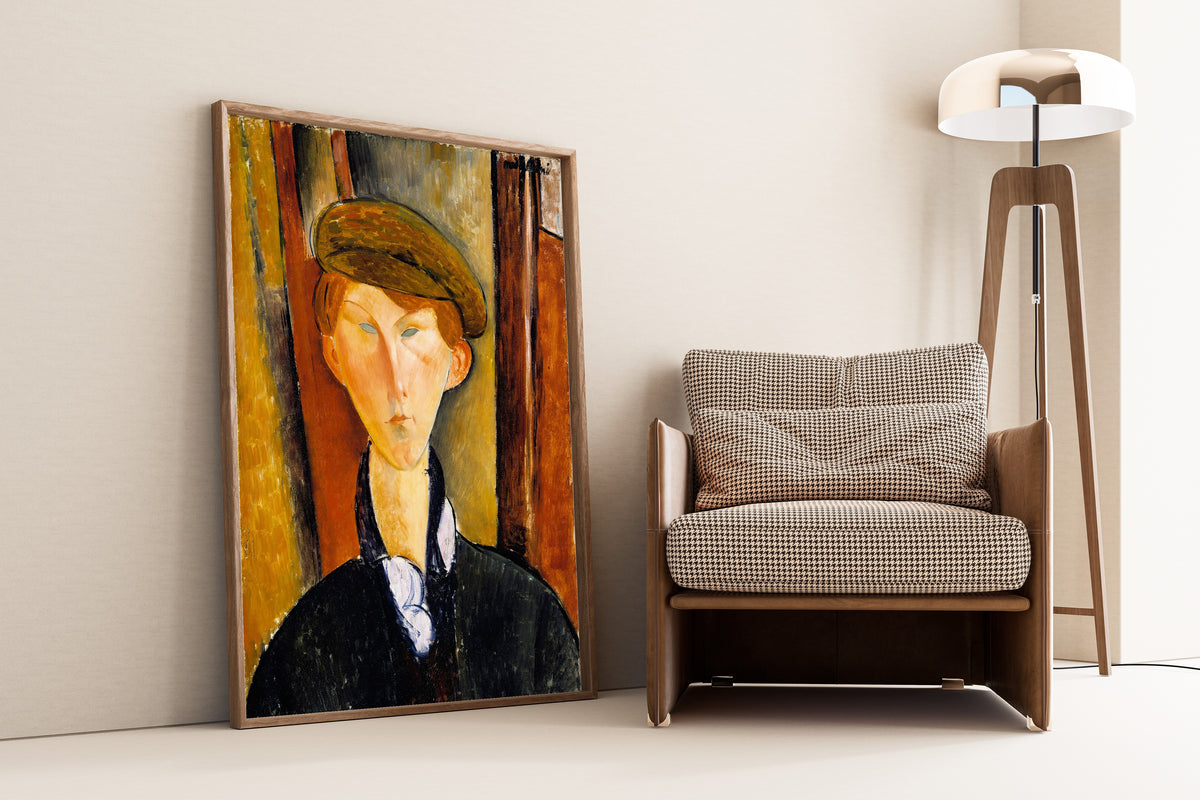 Young Man with a Cap by Amedeo Modigliani — framed and leaning against a wall beside an armchair and a floor lamp