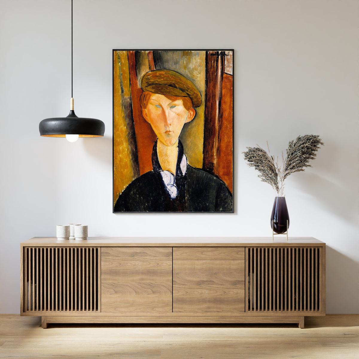 Young Man with a Cap by Amedeo Modigliani — framed above a slatted wood sideboard